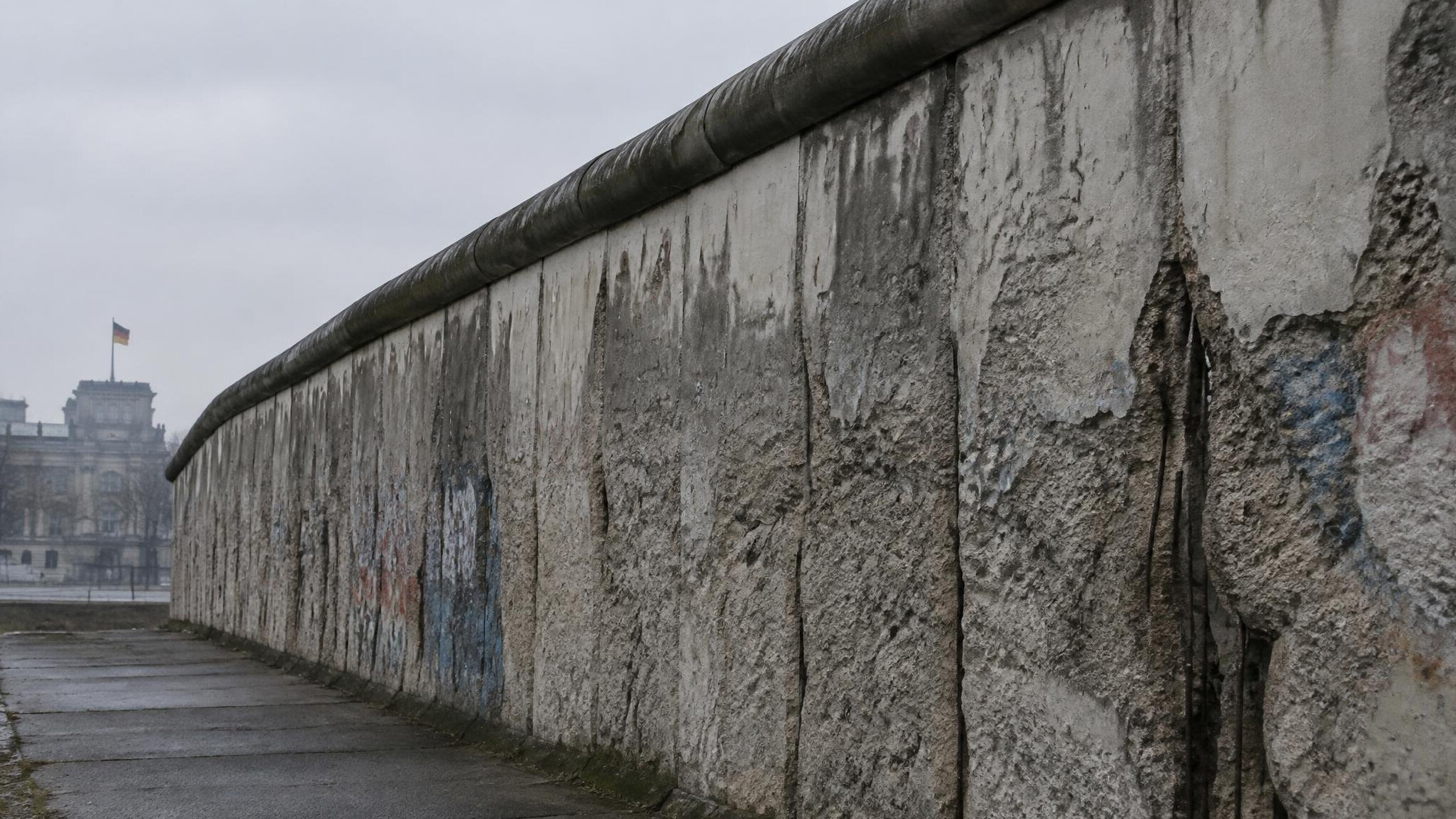 Remnant of the Berlin Wall with weathered concrete texture