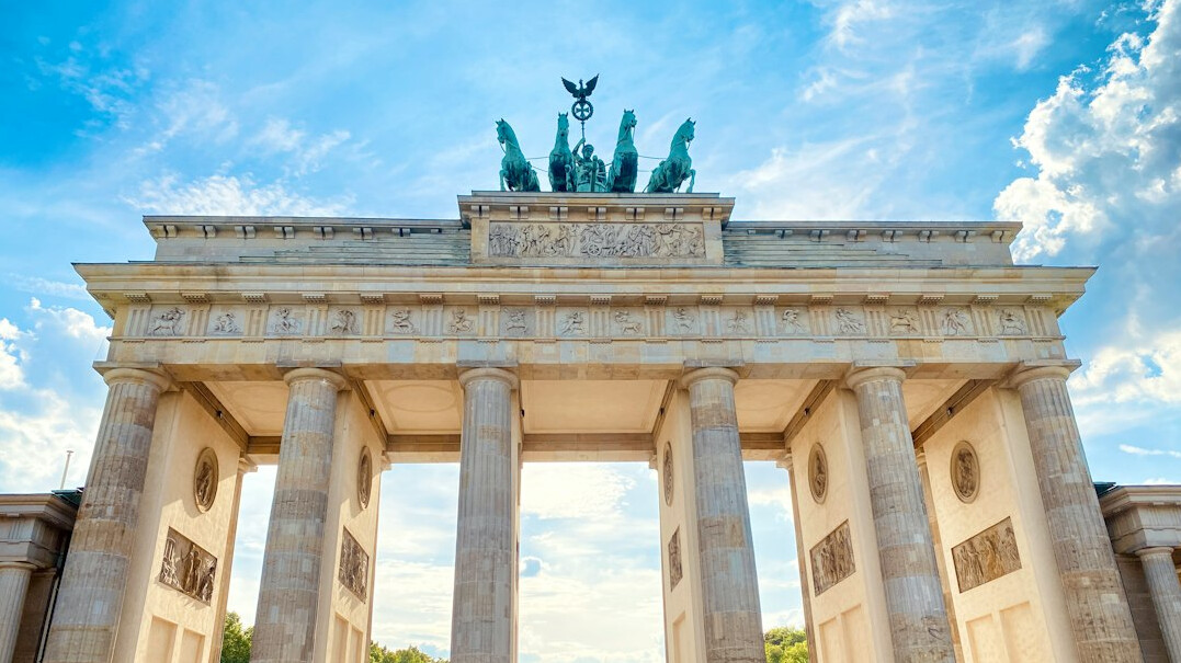 Neoclassical stone gate monument in Berlin at dusk